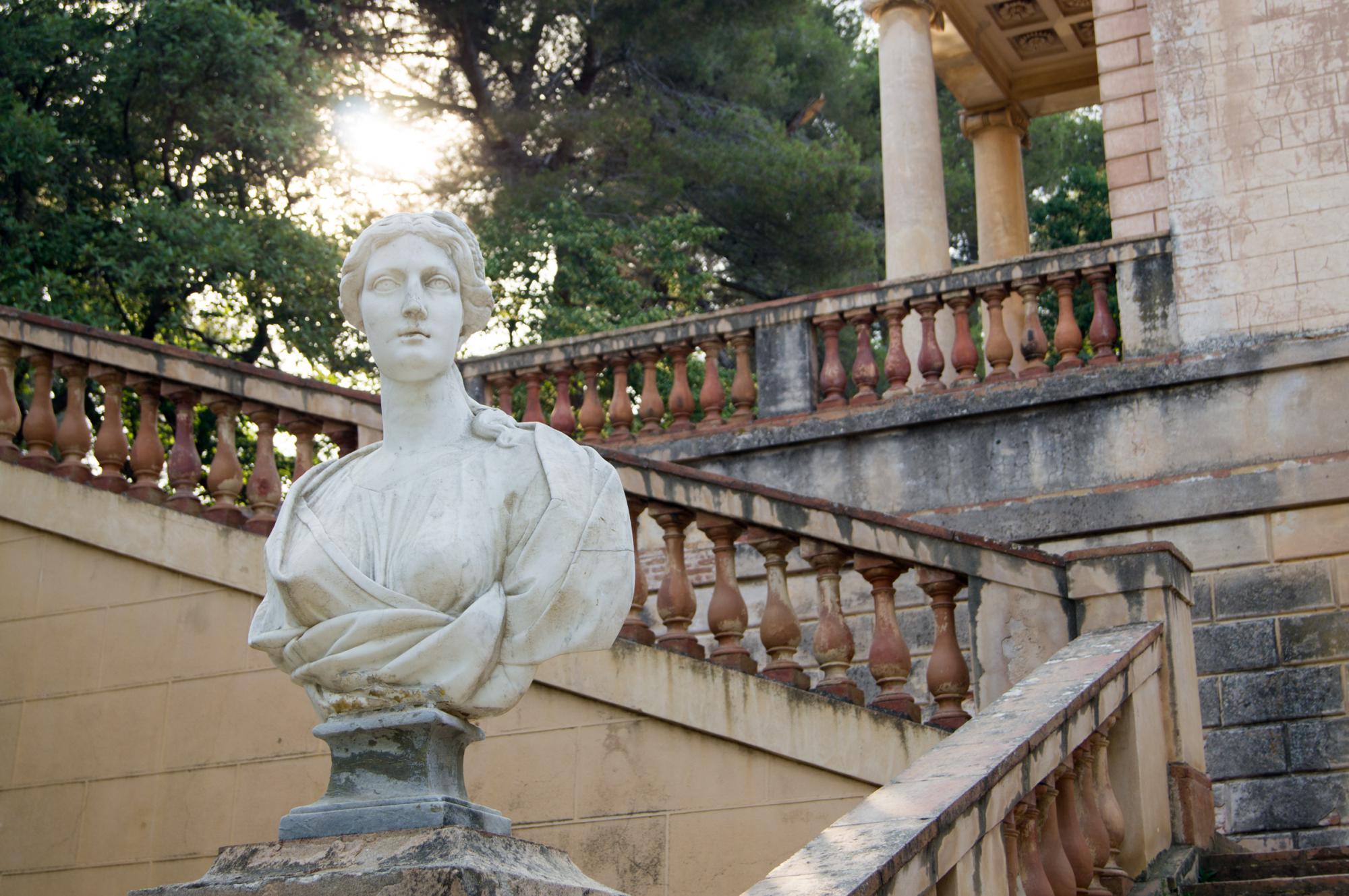 Antique sculpture in the park maze Horta in Barcelona