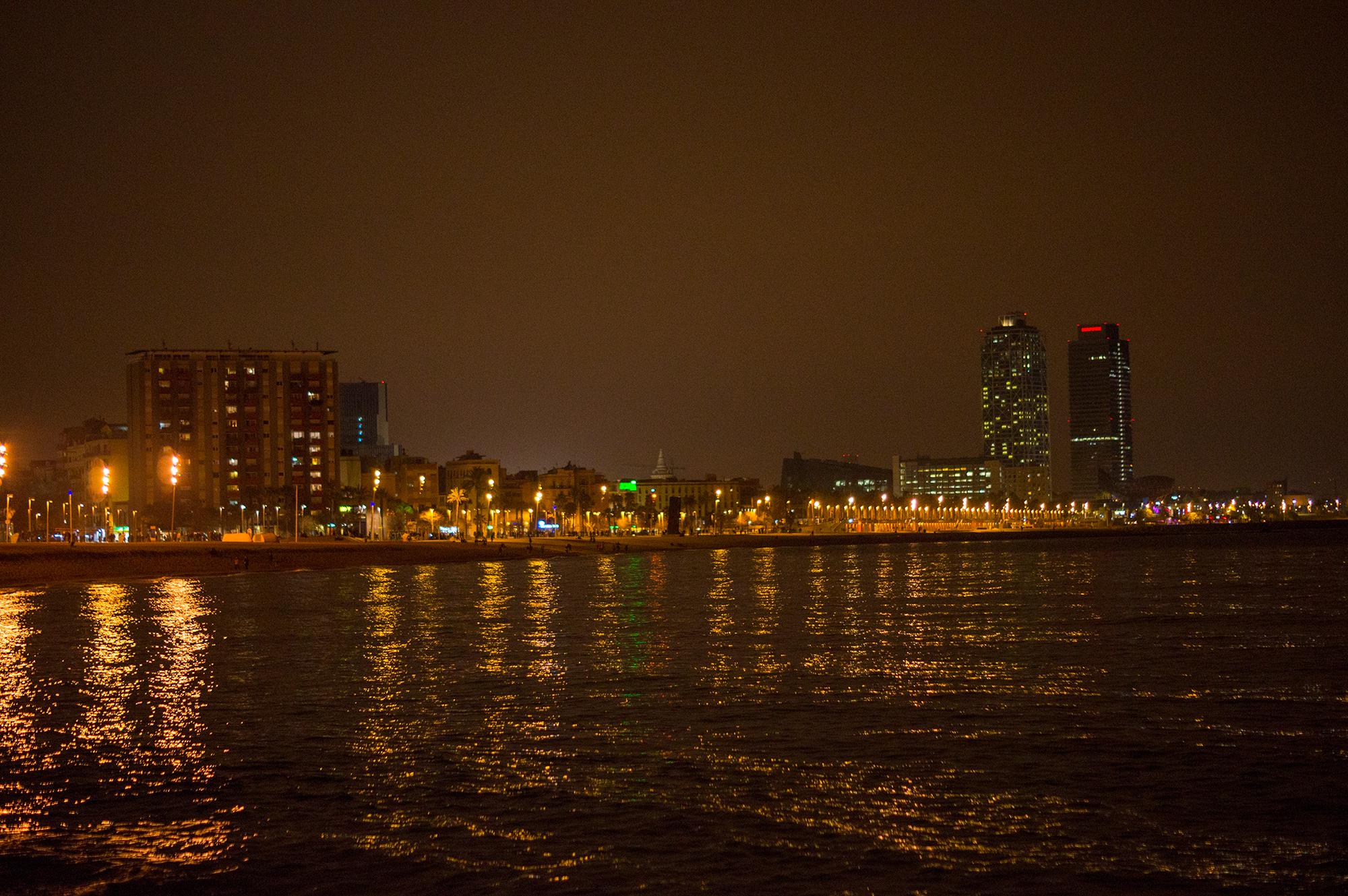 Night view of Barcelona from Platja de Sant Sebastià