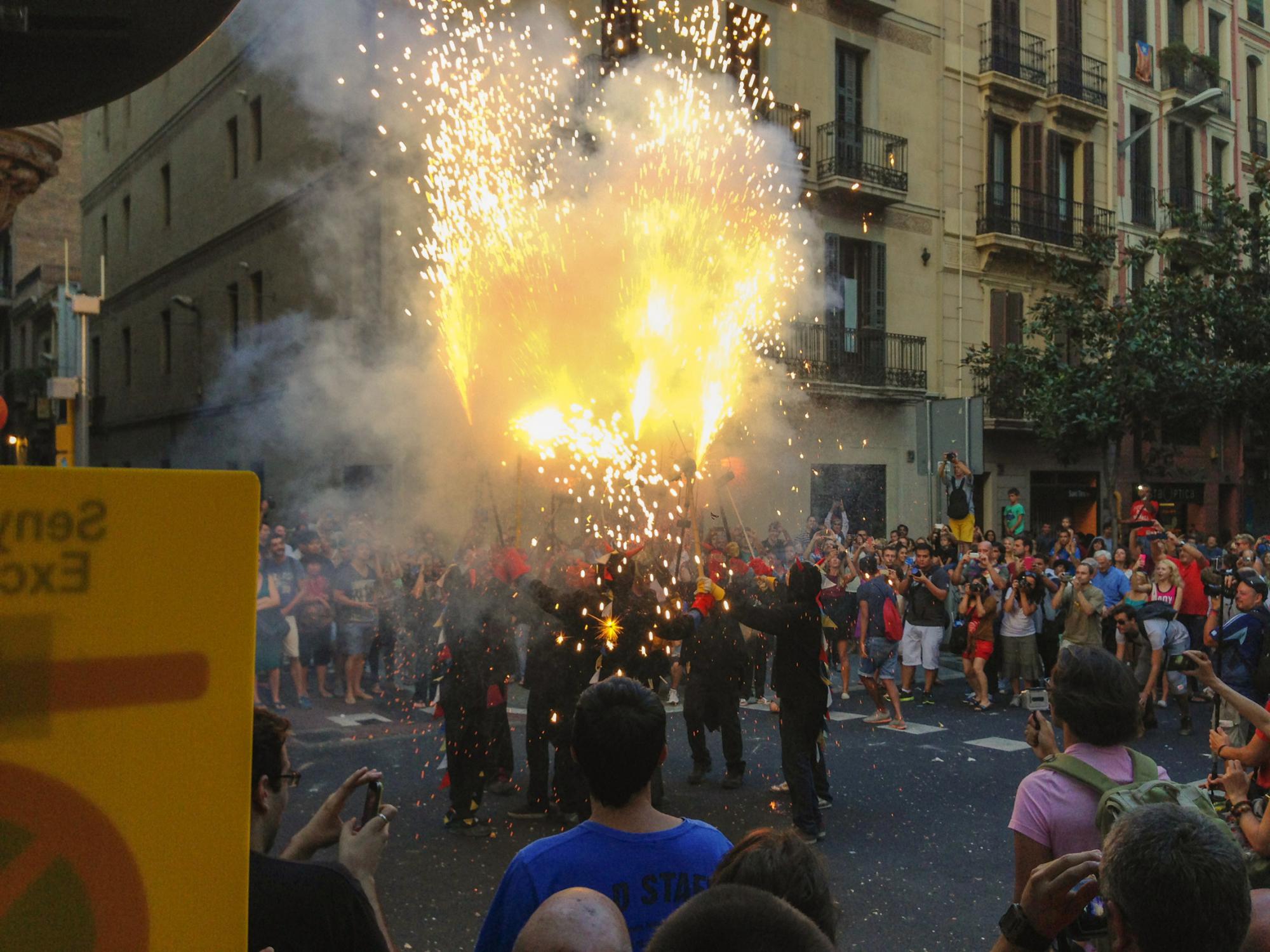 Fire show during parade on Carrer Gran de Gràcia, Barcelona